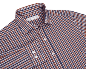 Blue and orange checkered shirt with a visible brand label on a white background