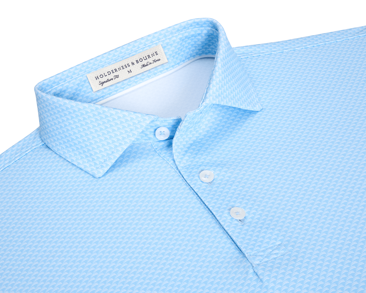 The Eaton Shirt: Vista Blue, a light-blue polo with a pointed collar, three-button placket, and woven texture, offers moisture-wicking and UPF 30+ protection.