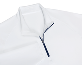 The Rodgers Quarter-Zip: White, featuring a navy-blue zipper, stand-up collar, and low-profile side pockets, ideal for golf with UPF 50+ protection.