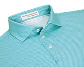 The Hicks Boys Shirt: Harbor, a mint-teal polo with a white dash pattern, three-button placket, spread collar, offering moisture wicking and UPF 50+ protection.