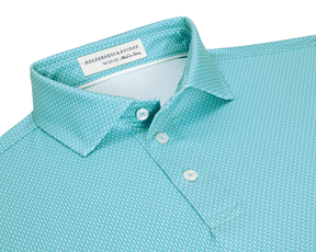 The Hicks Boys Shirt: Harbor, a mint-teal polo with a white dash pattern, three-button placket, spread collar, offering moisture wicking and UPF 50+ protection.