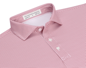 The Armfield Shirt: Liberty Red, featuring a red-and-white geometric print, classic point collar, three-button placket, and Holderness & Bourne label, ideal for golfing performance.