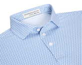 The Justice Boys Shirt: Harbor & Maidstone Blue features a light blue polo with a geometric eagle pattern, offering four-way stretch and UPF 50+ protection.