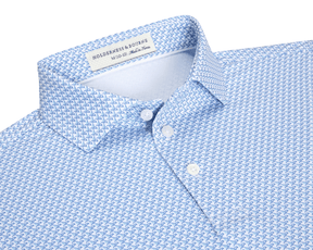 The Justice Boys Shirt: Harbor & Maidstone Blue features a light blue polo with a geometric eagle pattern, offering four-way stretch and UPF 50+ protection.