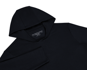 The Jackson Boys Hoodie: Black pullover with hood, long sleeves, and HOLDERNESS & BOURNE label, crafted from soft, stretchy fabric with UPF 50+ protection.