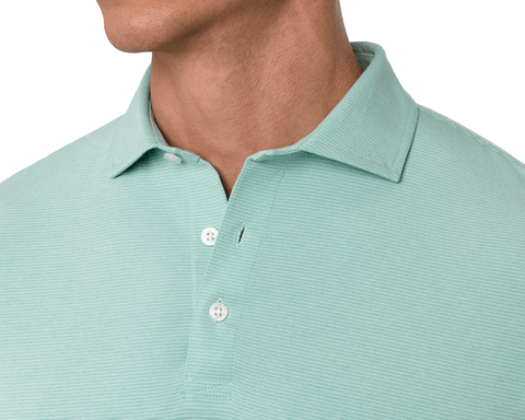 Close-up of a male model wearing The Holland Shirt: Heathered Cascade Green, showing the spread collar, stitched placket, and subtle repeat stripe.