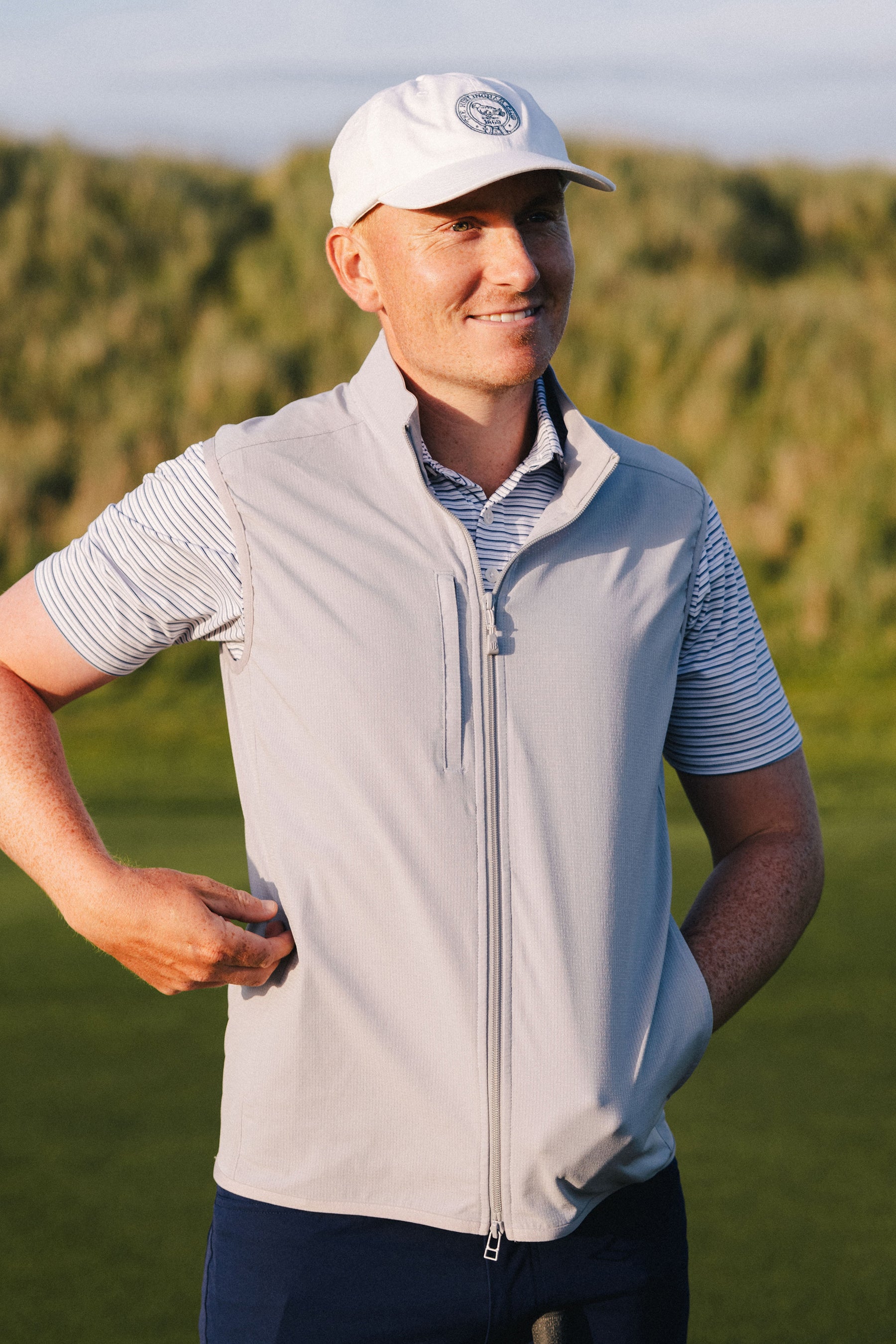 golf player wearing golf polo and hat