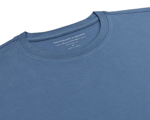 The Mason T-Shirt: Pacific Blue flat-lay showing its ribbed crew neck and Holderness & Bourne Premium Cotton Blend label, made in Peru.