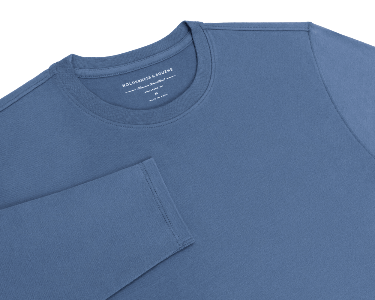 Folded flat-lay of The Montague Long Sleeve T-Shirt: Pacific Blue showing the crewneck with Holderness & Bourne neck label and the sleeve across the front.