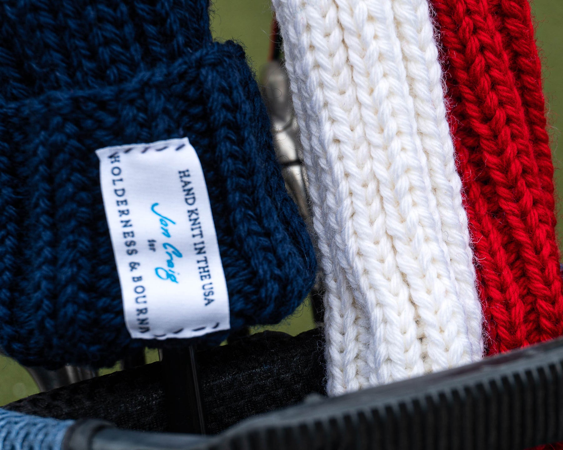 Close up shot of Holderness and Bourne custom knit headcovers.