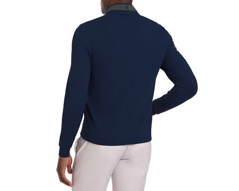 Person wearing a ivy and navy blue golf jacket with a white background
