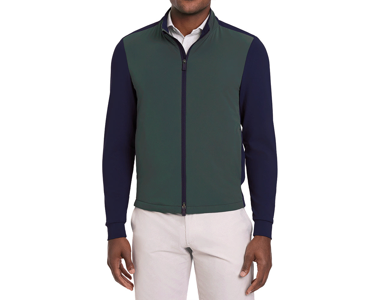 Green and navy long-sleeve golf jacket worn by a person on a white background