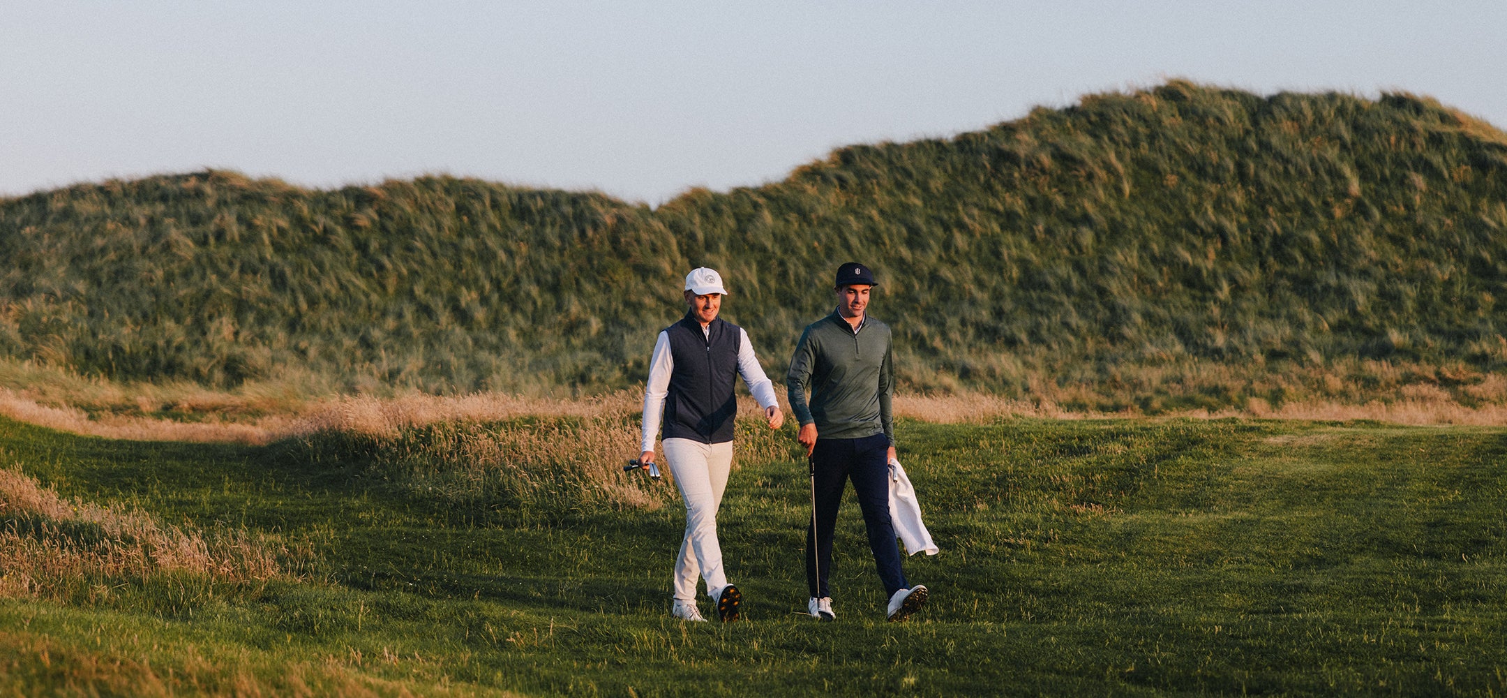 golf players walking on the golf course