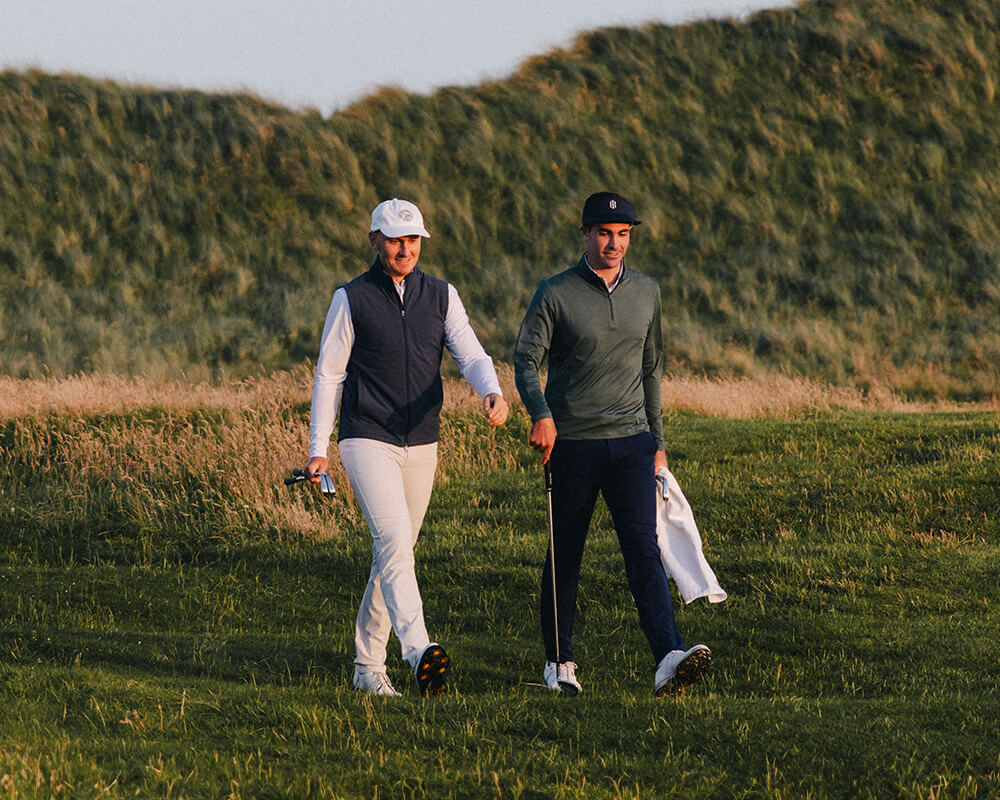 golf players walking on the golf course