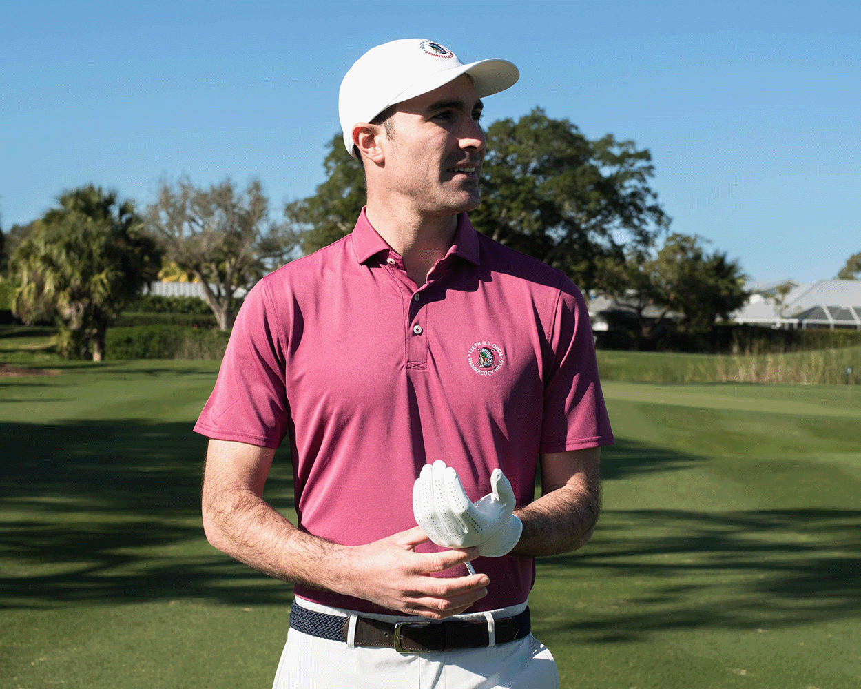 A man on a golf course wears the 2026 U.S. Open Macdonald Shirt, featuring a structured spread collar and breathable performance pique design.