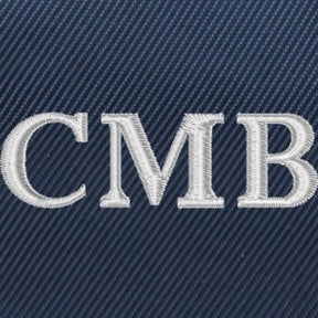 Close up of embroidered lettering on navy custom banker bag from Holderness and Bourne. 