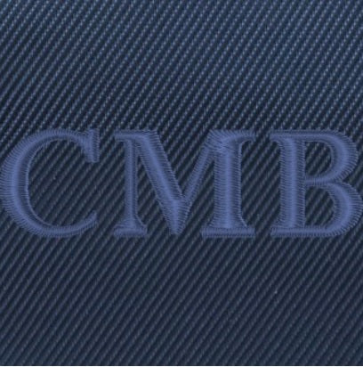Close up of embroidered lettering on navy custom banker bag from Holderness and Bourne. 