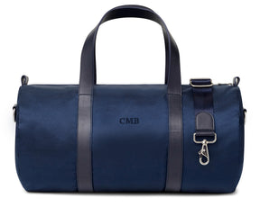 Navy custom banker bags with dark leather straps and embroidered lettering from Holderness and Bourne.