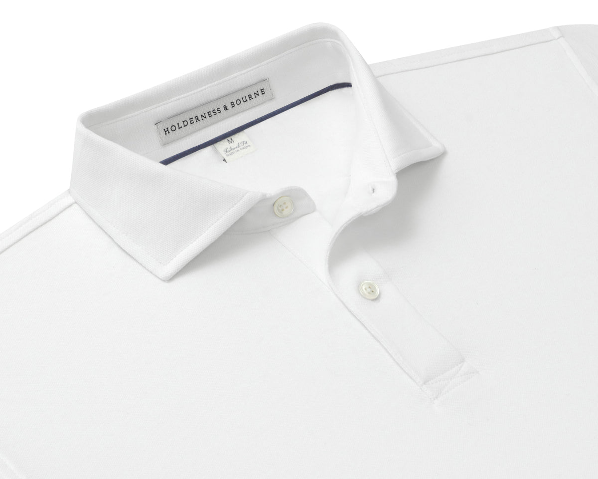 Folded Holderness and Bourne mens white polo shirt.