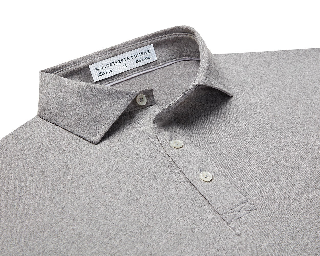 Folded Holderness and Bourne heathered gray polo.