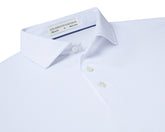 Folded Holderness and Bourne white golf shirt.