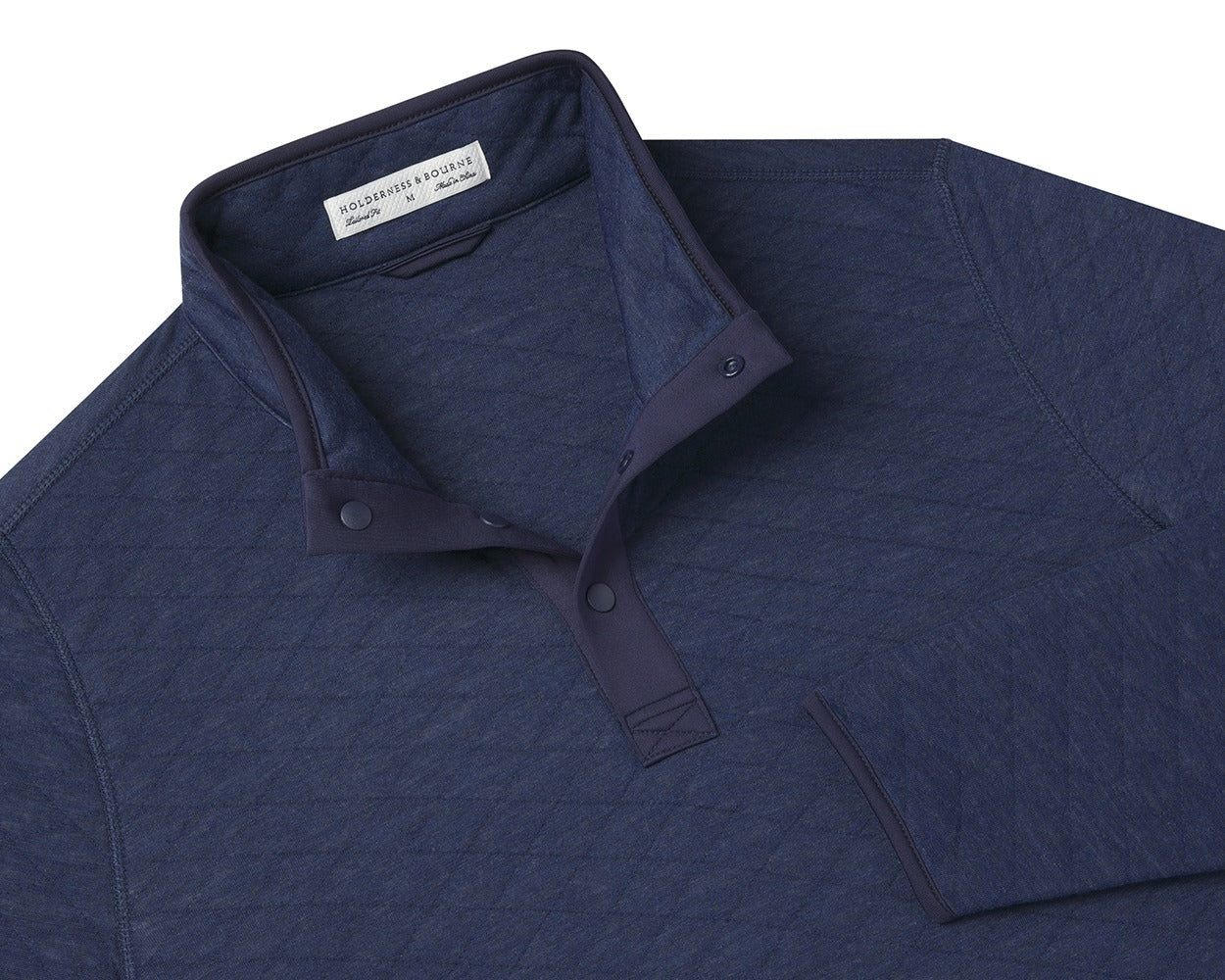 Folded Holderness and Bourne navy quilted pullover.