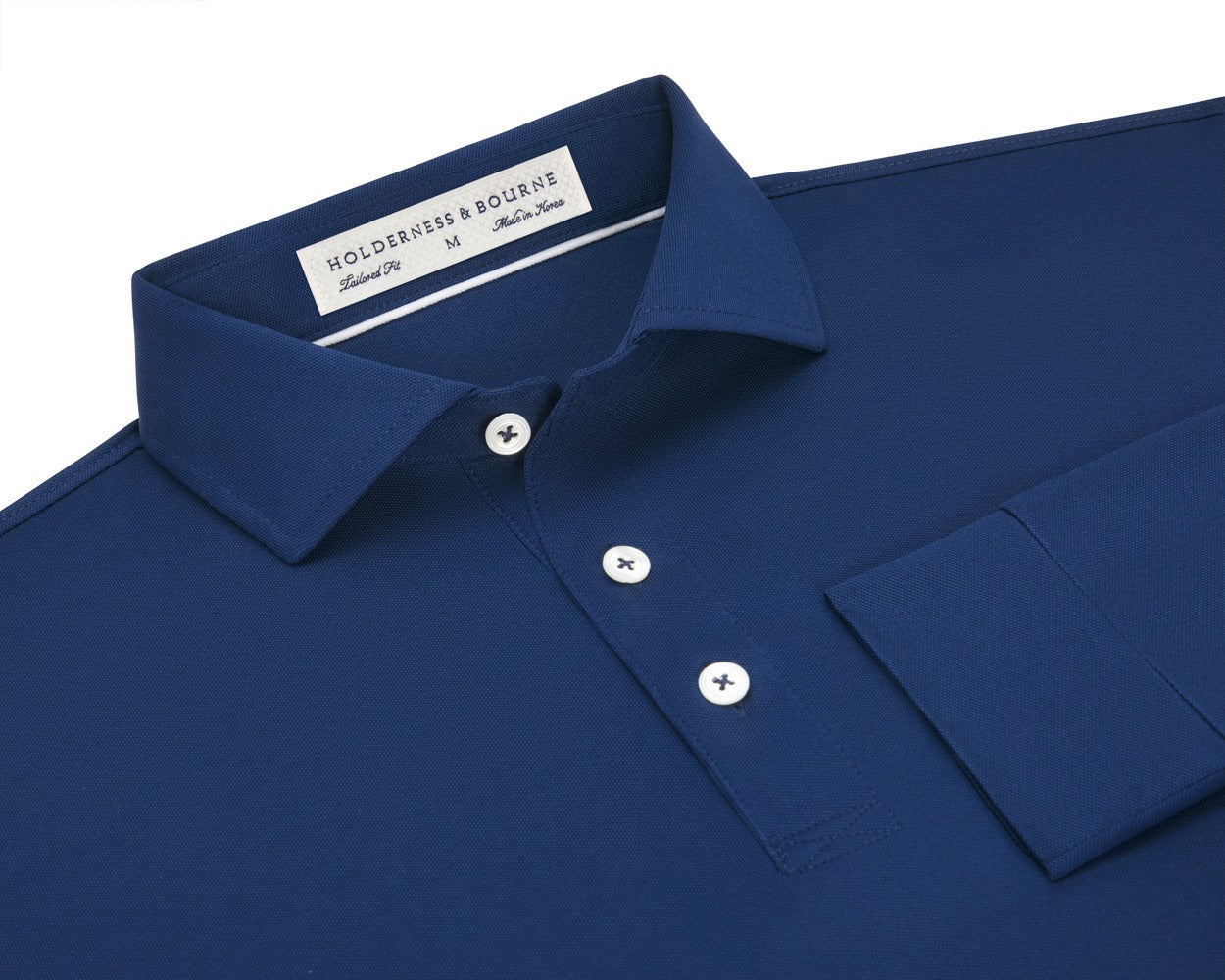 Folded Holderness and Bourne navy blue long sleeve shirt.