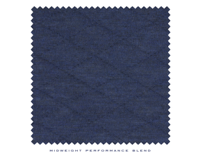 Close up shot of navy men's quilted pullover material from Holderness and Bourne.